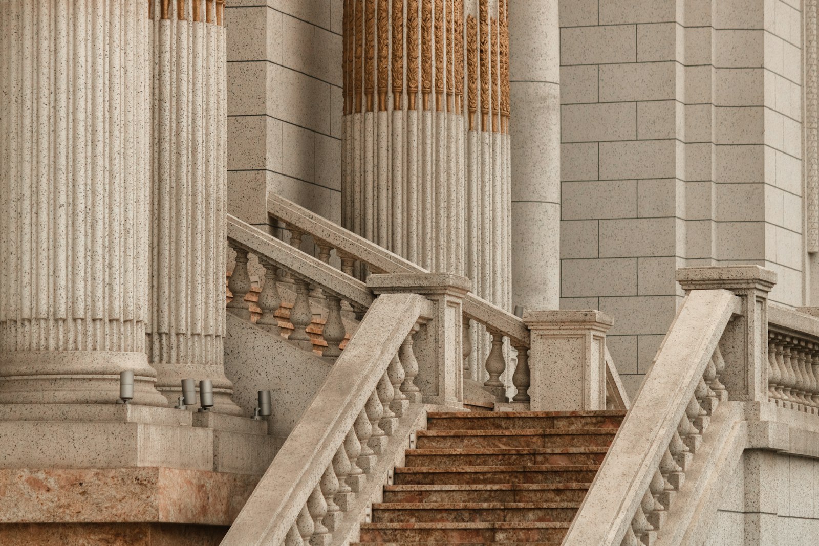 Stone steps rising between classical columns